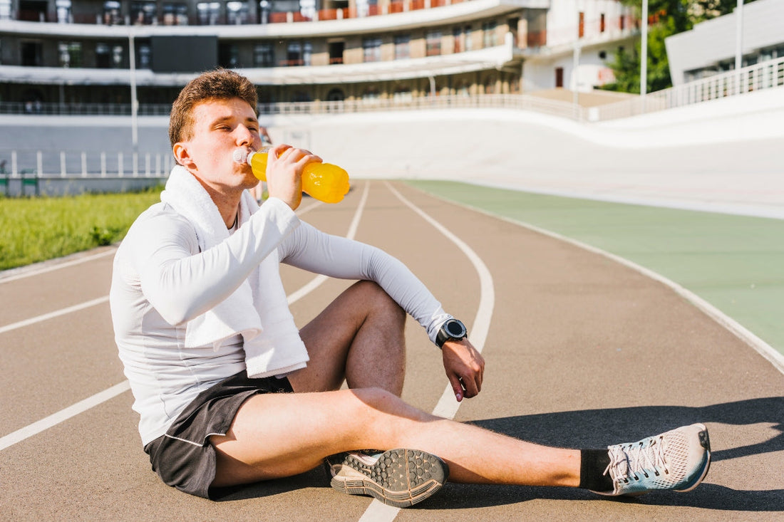 Man taking pre-workout drink with electrolytes