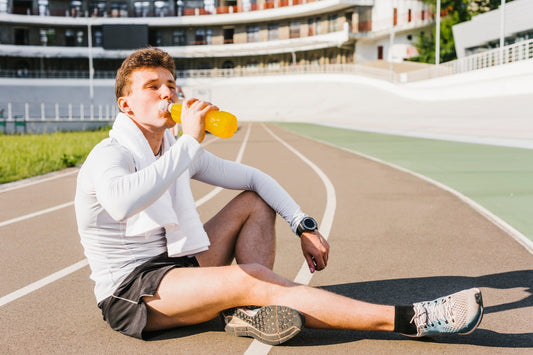 Man taking pre-workout drink with electrolytes